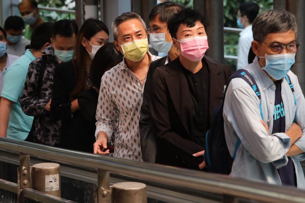 People wearing face masks are seen in Hong Kong’s Central district . Photo: K.Y. Cheng