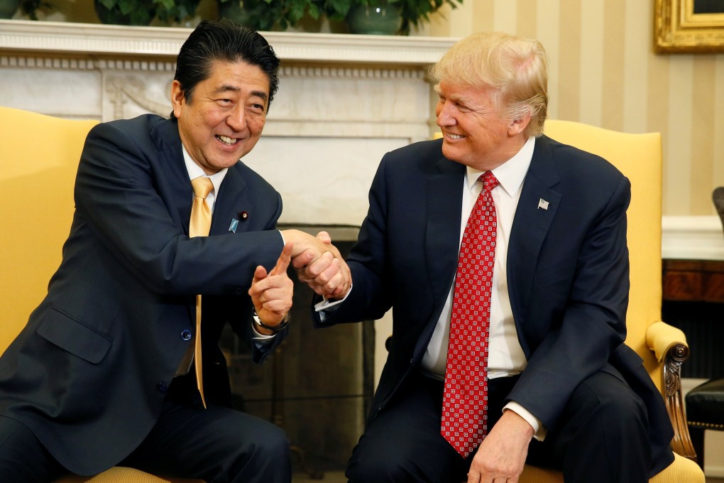 US President Donald Trump shakes hands with then Japanese prime minister Shinzo Abe during their meeting in the White House in Washington in February 2017. Abe’s close personal relationship with Trump failed to temper the president’s actions on matters of importance. Photo: Reuters