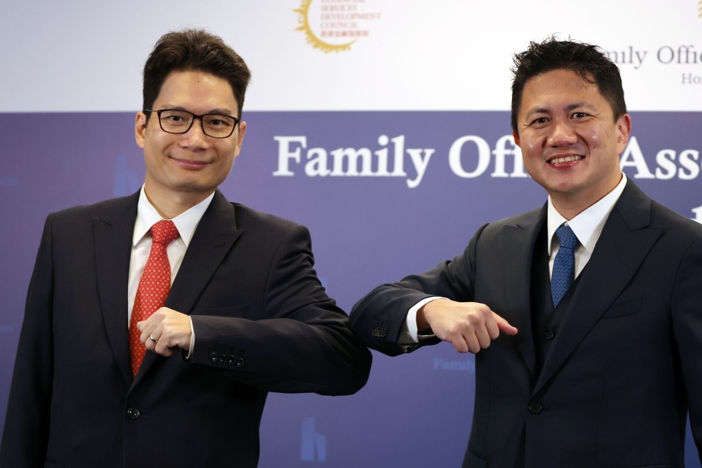 Joseph Chan Ho-lim (left), Under Secretary for Financial Services and the Treasury, and Kwan Chi-man, chairman of the Family Office Association of Hong Kong, attend the opening ceremony of Family Office Association of Hong Kong at the InvestHK office in Admiralty, on Tuesday. Photo: Nora Tam