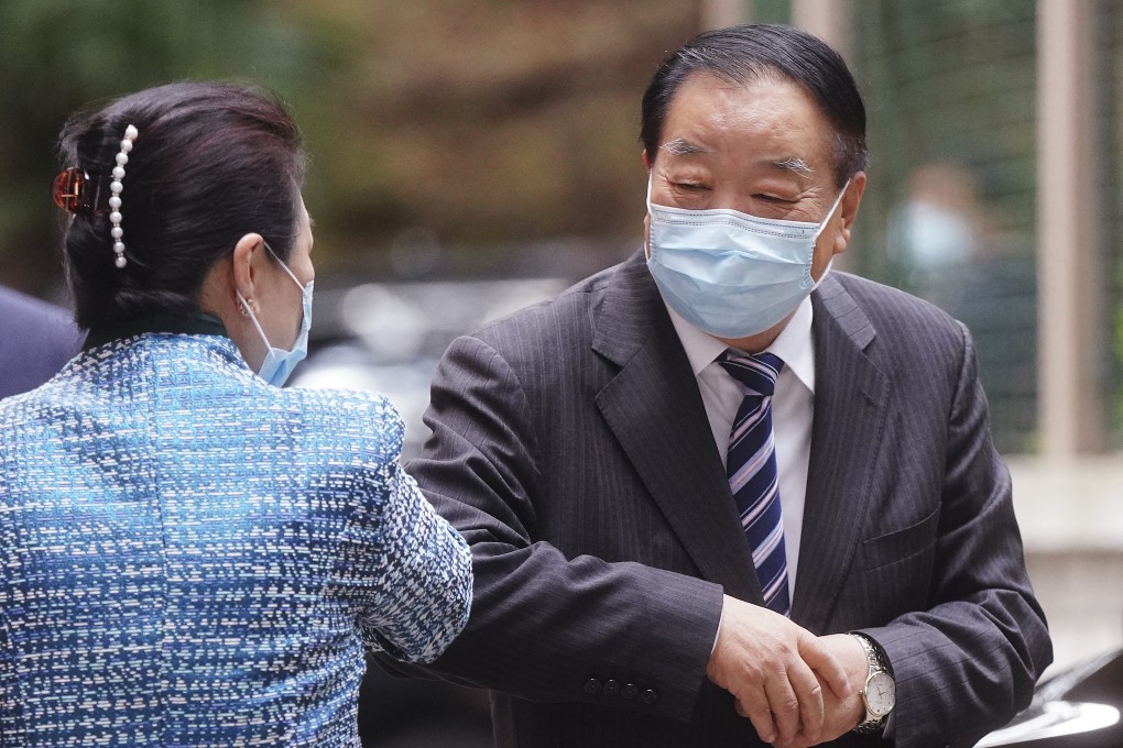 Secretary for Justice Teresa Cheng (left) greets former Basic Law Committee member Qiao Xiaoyang at a legal summit on Tuesday. Photo: Sam Tsang