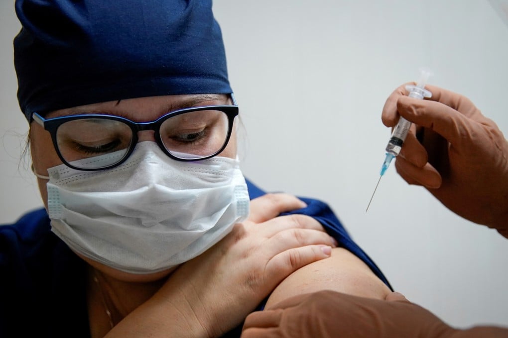 A health worker at a regional hospital receives Russia’s Sputnik V vaccine shot in Tver, Russia in October. Photo: Reuters