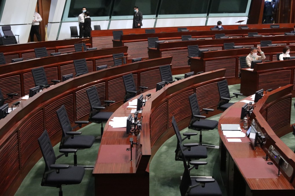 Empty seats in the Legislative Council chamber as sessions resume after 15 pan-democrats announced their resignation in response to four others being disqualified. Photo: K.Y. Cheng
