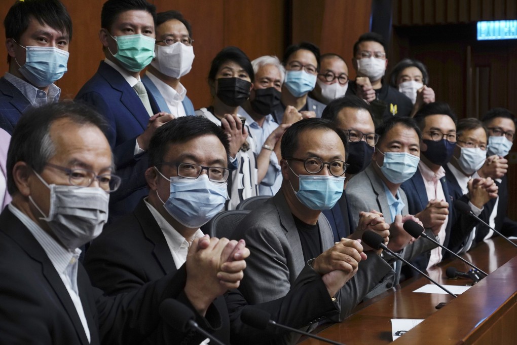Hong Kong’s opposition lawmakers pose for a picture before a press conference at the Legislative Council on November 9. Photo: AP