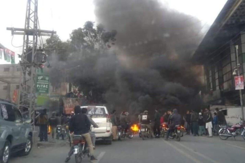 Protesters block a road with burning debris in Gilgit, capital of Pakistan’s Gilgit-Baltistan region, amid allegations of vote rigging in the recent legislative assembly elections. Photo: Tuyyab Babri