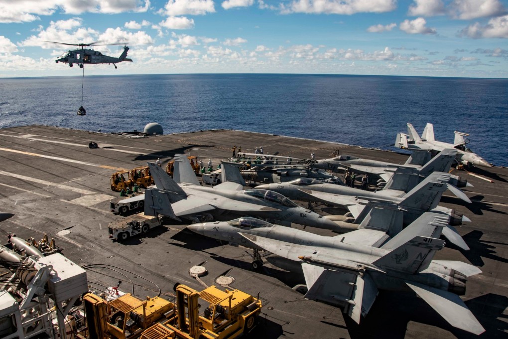 An F/A-18E Super Hornet manoeuvres on the flight deck of the USS Ronald Reagan aircraft carrier. Photo: US Pacific Fleet
