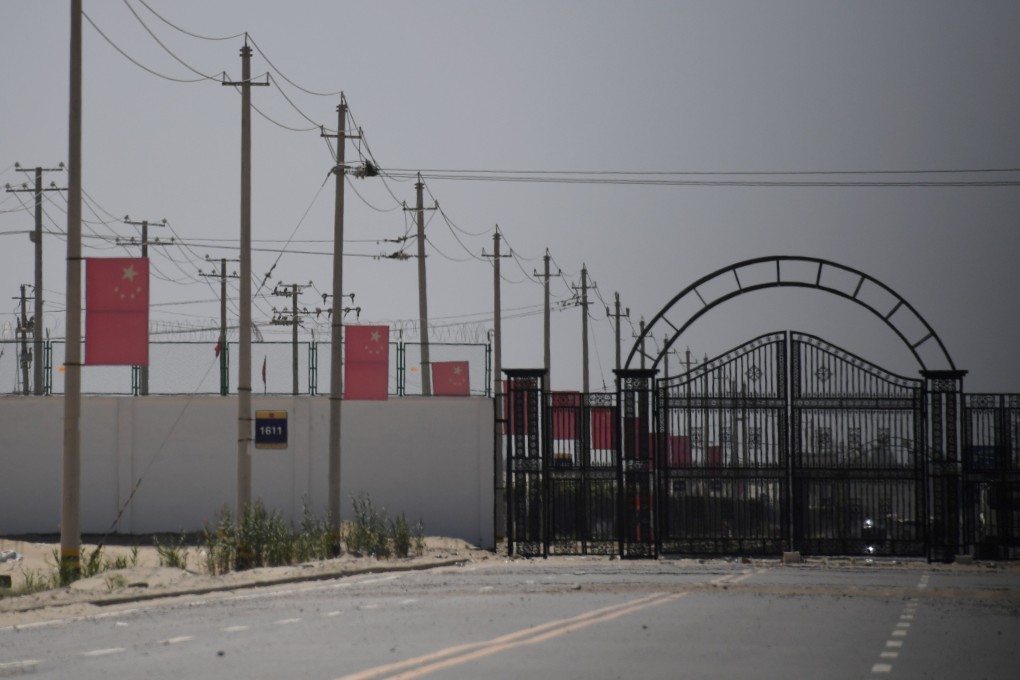 Chinese flags are seen on a road leading to a facility believed to be a re-education camp in China’s Xinjiang region. File photo: AFP