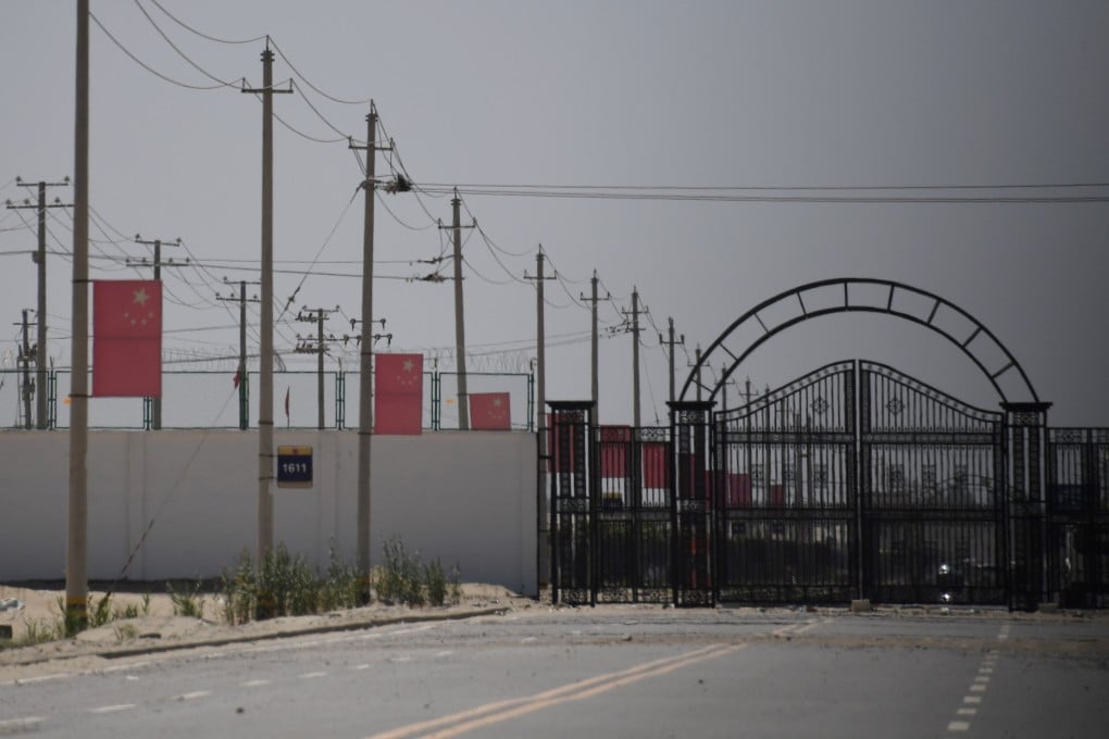 Chinese flags are seen on a road leading to a facility believed to be a re-education camp in China’s Xinjiang region. File photo: AFP