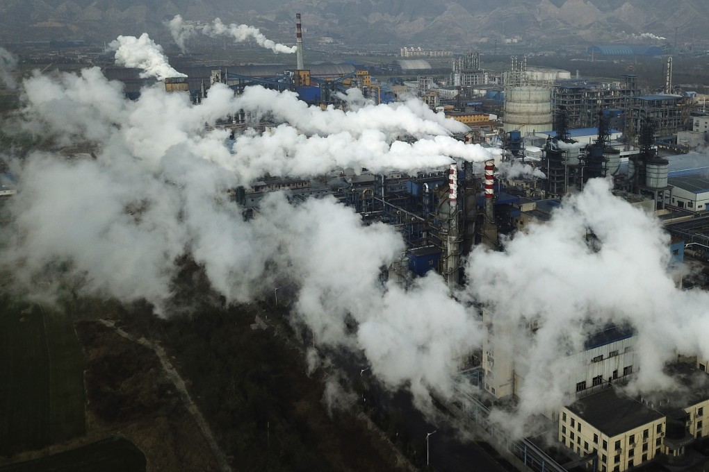 Smoke and steam rising from a coal processing plant in Hejin in central China's Shanxi province in 2019. Photo: AP