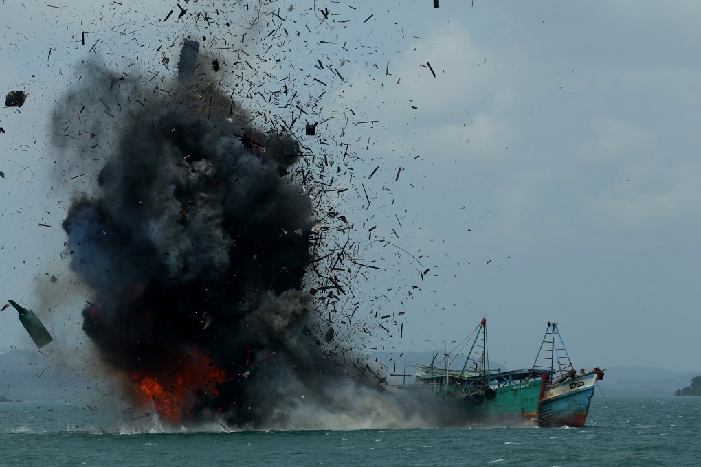 A boat being blown up by the Indonesian government in 2016 after it was seized for illegal fishing. Photo: AFP