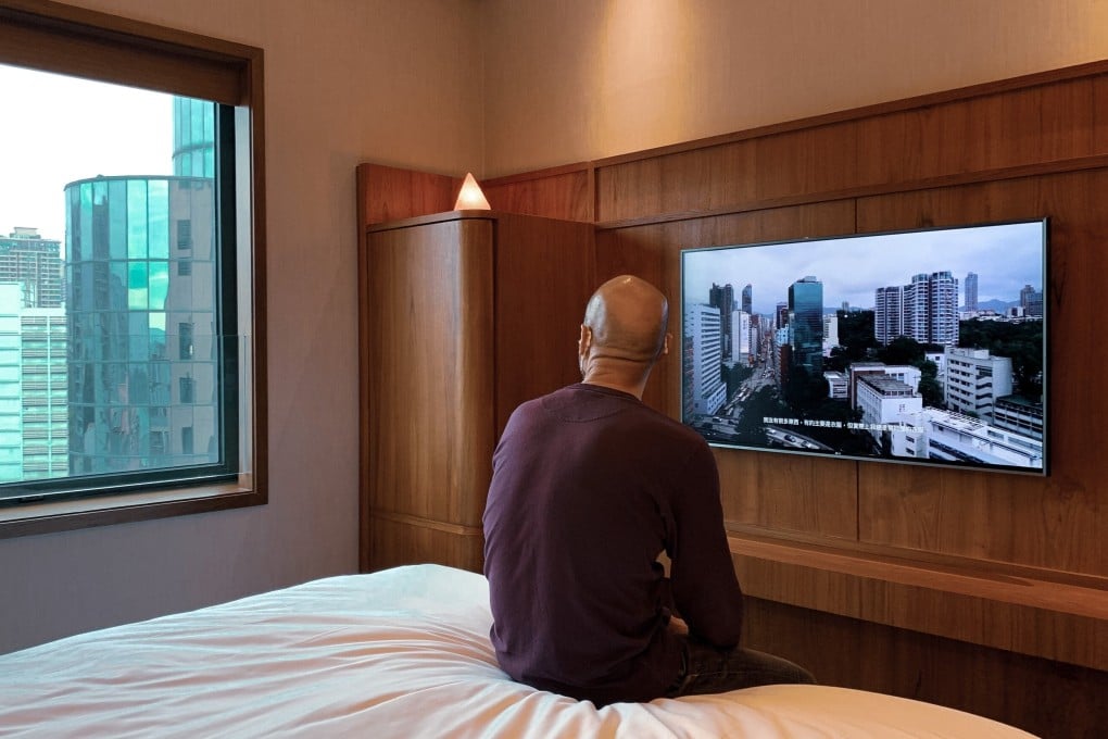 Artist Leung Chi-wo sitting in a hotel room at Eaton HK where his new exhibition "Home and Nonhome" is partially staged. Photo: Jockey Club New Arts Power