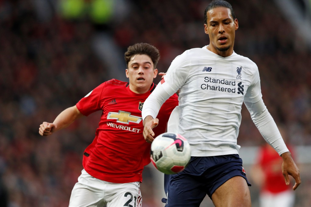 Liverpool's Virgil van Dijk in action with Manchester United's Daniel James. Photo: Reuters
