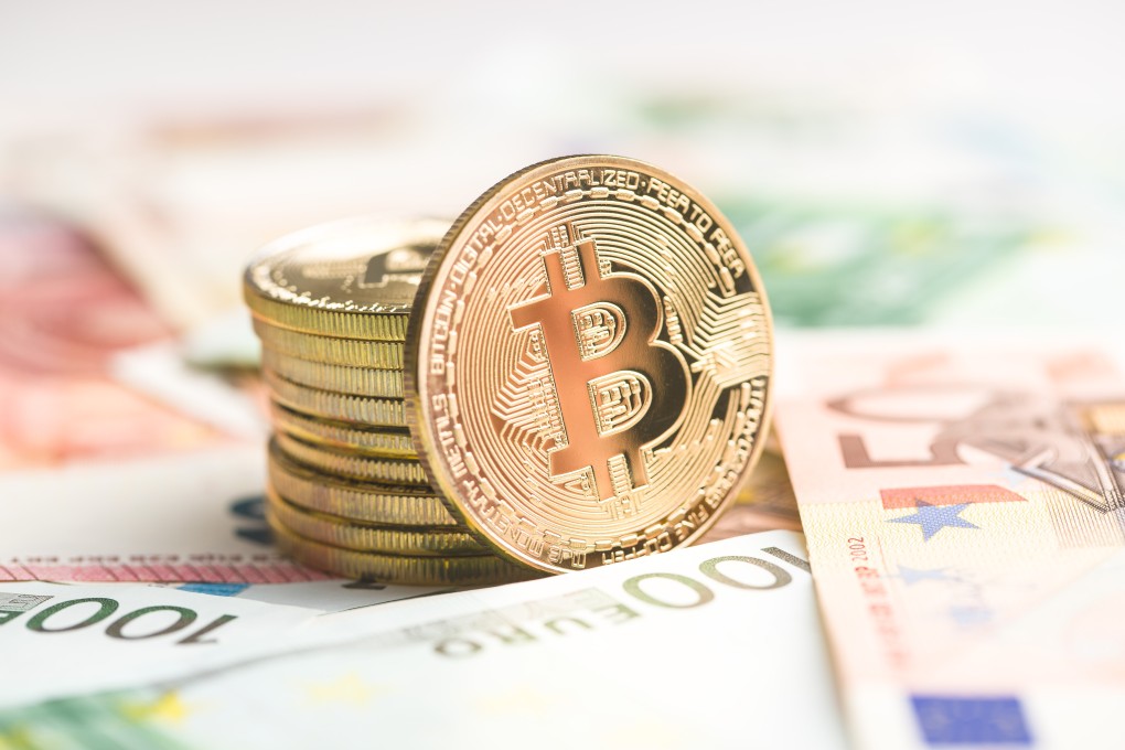 The golden bitcoin. Cryptocurrency and euro currency. Photo: Shutterstock