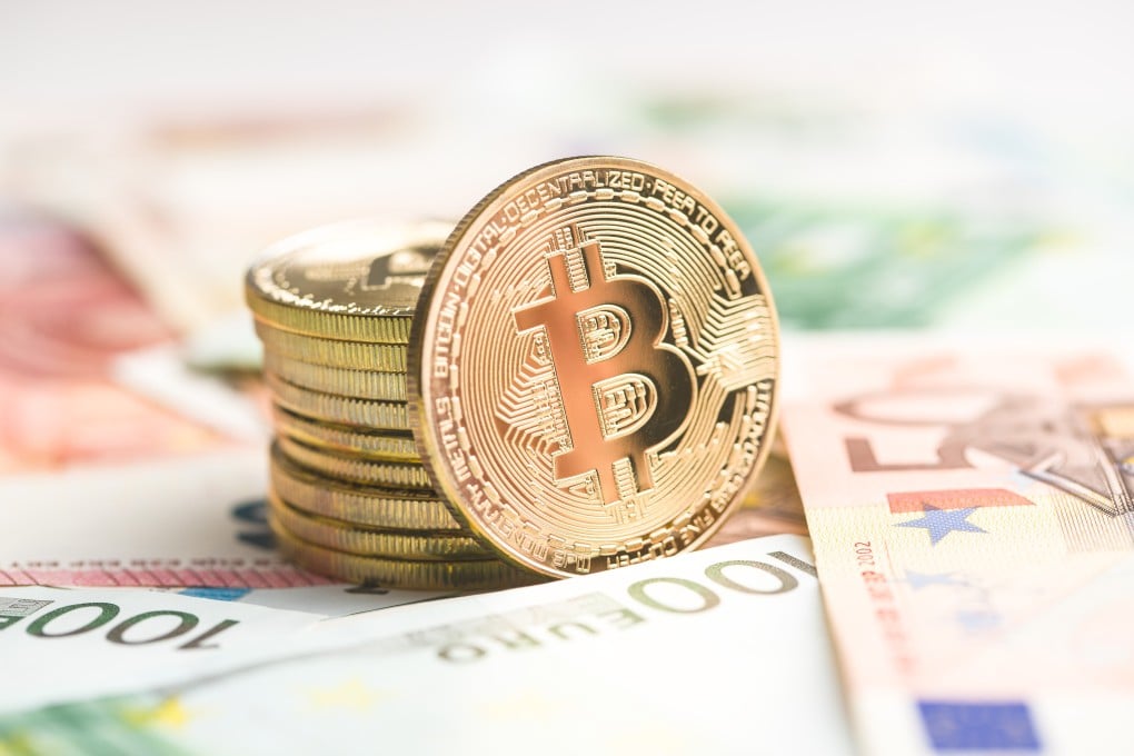 The golden bitcoin. Cryptocurrency and euro currency. Photo: Shutterstock