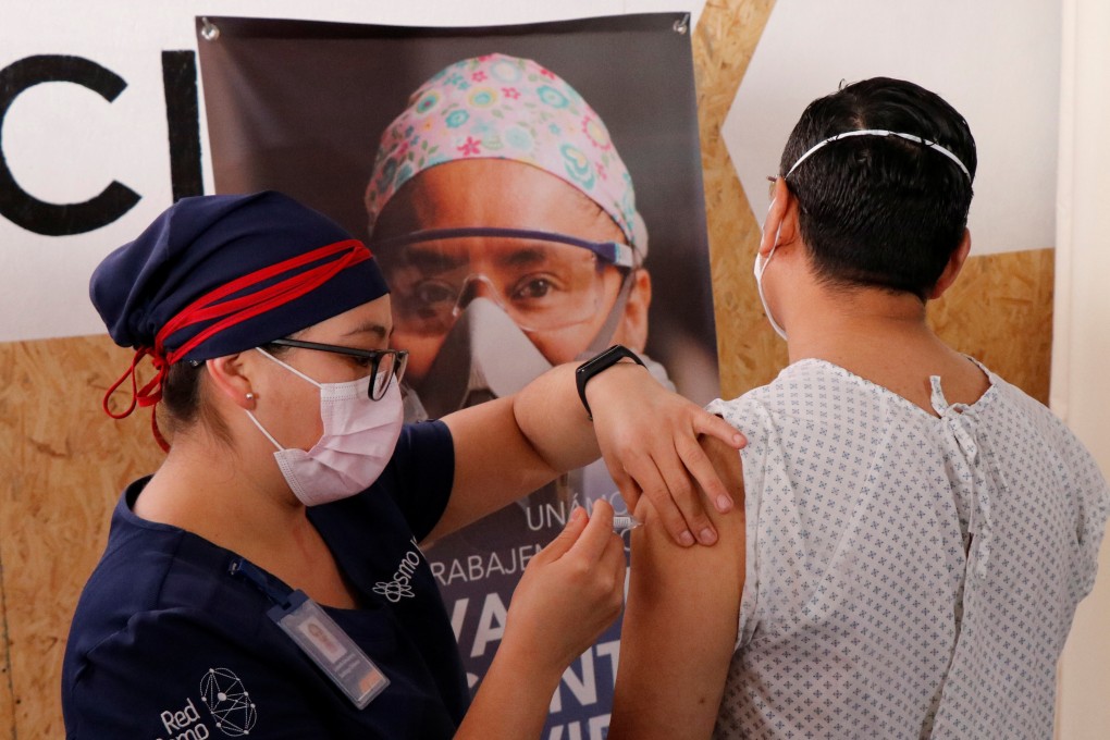 A volunteer in Mexico is given CanSino’s vaccine candidate as part of the late-stage trial currently running the country. Photo: Reuters