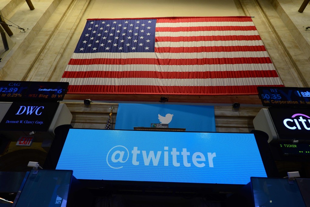 The Twitter logo is seen at the New York Stock Exchange, with a US flag in the background. The company said all existing tweets on White House accounts will be archived and reset to zero tweets on inauguration day. Photo: AFP