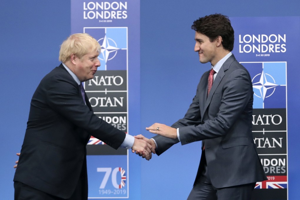 British Prime Minister Boris Johnson, left, and Canadian Prime Minister Justin Trudeau at The Grove hotel and resort in Watford, Hertfordshire, England. Photo: AP