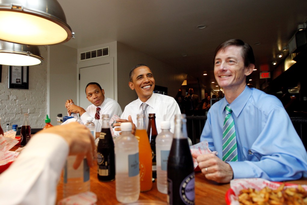 Then-Chief of Staff of the Vice President Bruce Reed (right) with then-US President Barack Obama (centre) at the Good Stuff Eatery on Capitol Hill in Washington, August 3, 2011. Reed is now tech adviser to President-elect Joe Biden. Photo: Reuters