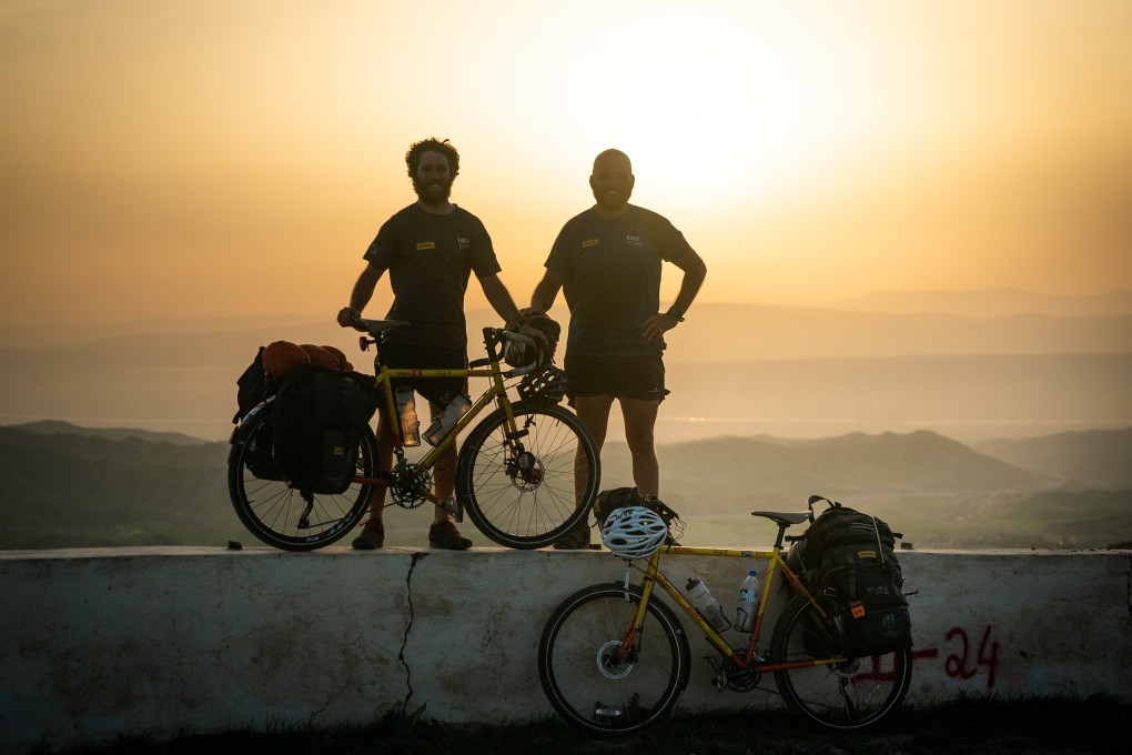 James Owen and Ron Rutland in Tajikistan on their cycle from London to Japan for the Rugby World Cup. Photo: DHL Race to Rugby World Cup