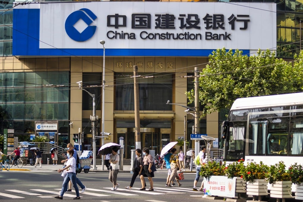 People walk in front of the China Construction Bank branch in Shanghai in August 2020. The lender has decided not to proceed with a digital bond issue on blockchain without an explanation. Photo: EPA-EFE