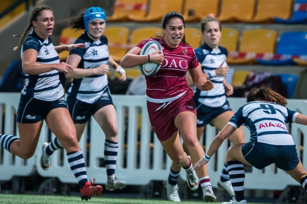 Kowloon winger Anjalika Ybema scores a try against HKFC Ice in round three of the domestic women‘s rugby league on Saturday. Photo: Ike Images