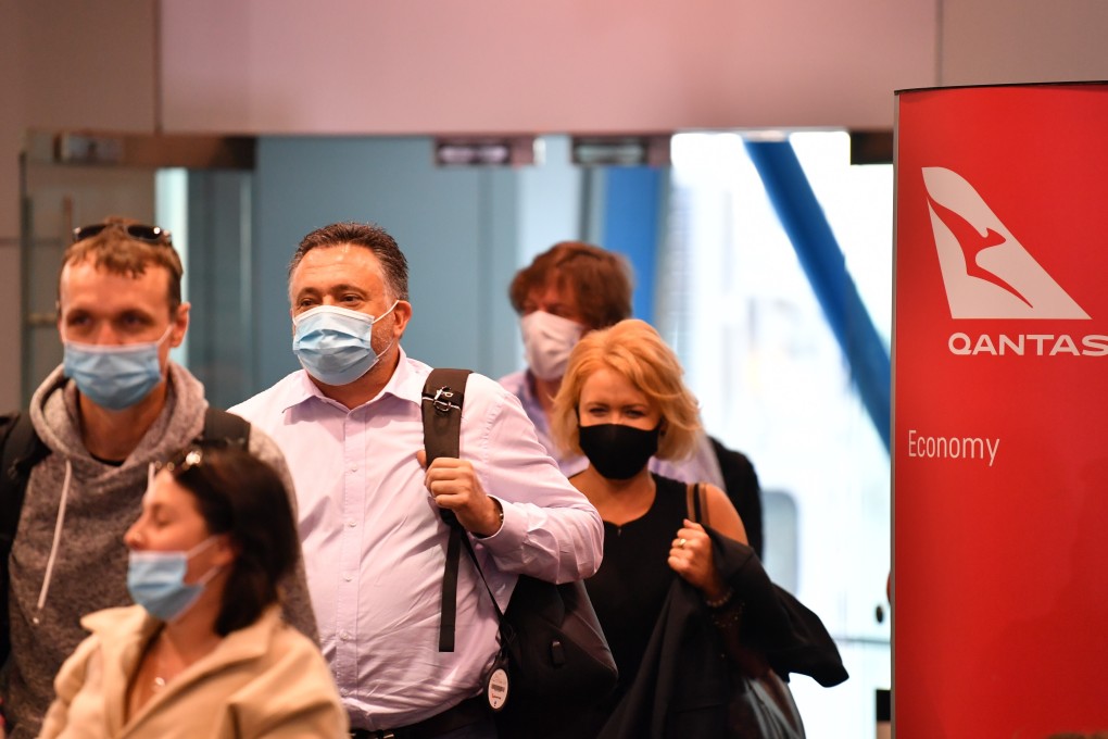 Passengers disembark a Qantas flight to Sydney from Melbourne on Monday. Photo: DPA