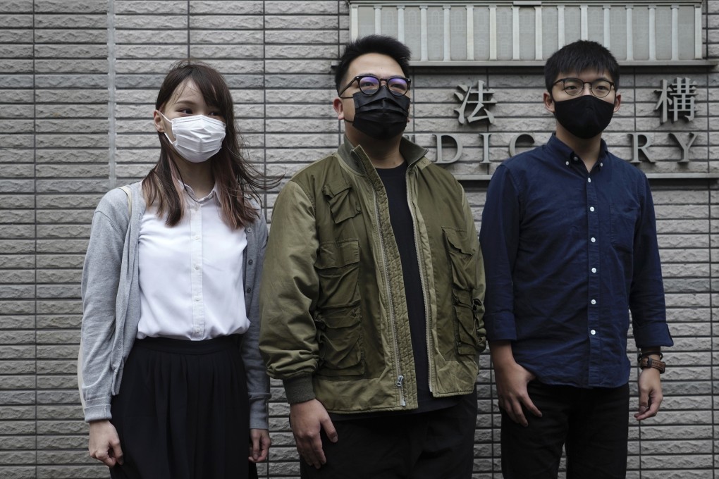 Hong Kong activists (from left) Agnes Chow, Ivan Lam and Joshua Wong arrive at a Hong Kong court on Monday. Photo: AP