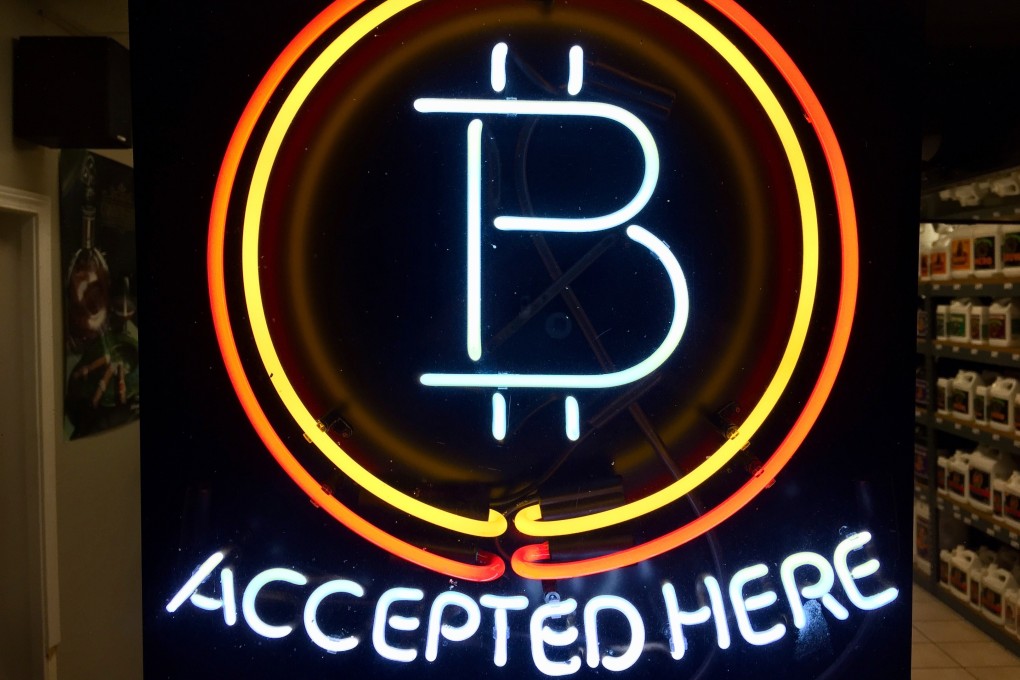 A neon sign at a shop in Hillsboro, Oregon, showing that bitcoin is accepted as payment. Photo: AP