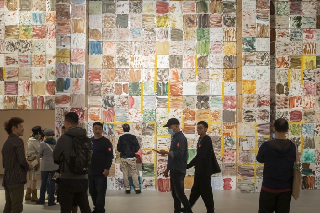 “A Room that can Move” at Shanghai Power Station of Art museum features an installation by Zhang Enli composed of over 1,000 painted paper boxes. The exhibition spans the Chinese artist’s journey from dark-hued figurative art to abstract painting. Photo: Shanghai Power Station of Art Museum