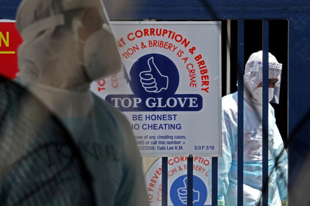 Medical workers are seen at a Top Glove hostel under enhanced lockdown in Klang, Malaysia. Photo: Reuters
