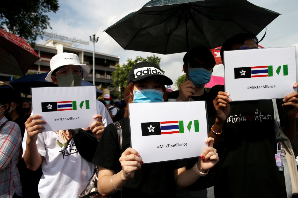 Protesters hold #MilkTeaAlliance signs during a rally in Bangkok, in August. Photo: Reuters