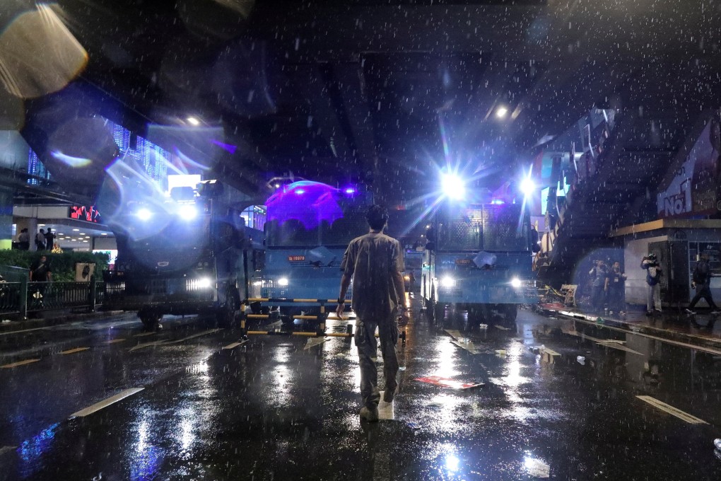 Reuters Southeast Asia chief Matthew Tostevin hailed this unidentified man as a “protester standing his ground”. The photograph is extremely different visually from the Thai PBS version, despite being taken around the same time. Photo: Soe Zeya Tun / Reuters