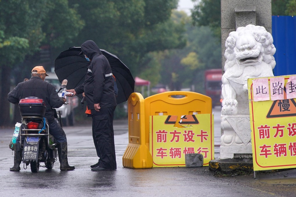 A temperature check point in Shanghai on Wednesday. Recent measures taken by the authorities to contain a fresh Covid-19 outbreak are ‘too harsh’ and may hurt the city’s economy, according to one small business owner. Photo: Reuters