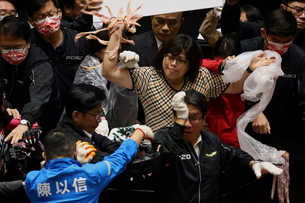 Taiwan lawmakers throw pork intestines at each other during a scuffle in the parliament in Taipei, Taiwan, on Friday, November 27. Photo: Reuters