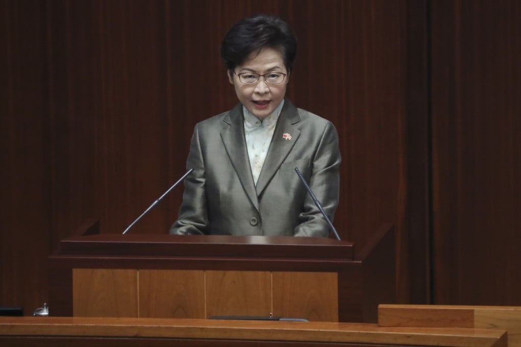 Chief Executive Carrie Lam giving her policy address in the Legco chamber on November 25. Her No 1 task now should be to contain Covid-19. Photo: Sam Tsang