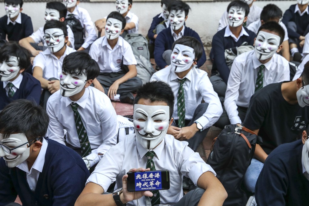 Pupils hold a sit-in outside a Hong Kong school last year. Photo: Winson Wong