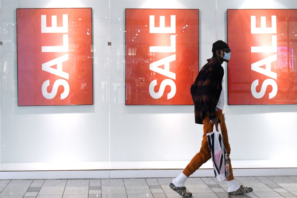 A shopper walks through a mall in California during the Black Friday shopping sales. Photo: Orange County Register via dpa