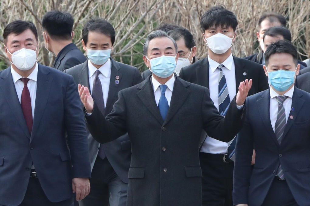 Wang Yi (centre) visits the National Assembly in Seoul. Photo: AFP