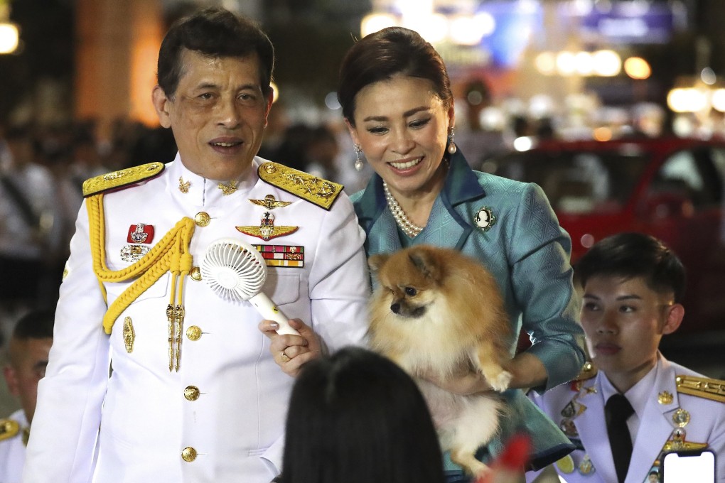 Thai King Maha Vajiralongkorn, left, and Queen Suthida, right, meet supporters after attending a ceremony in Bangkok on Wednesday. Photo: AP
