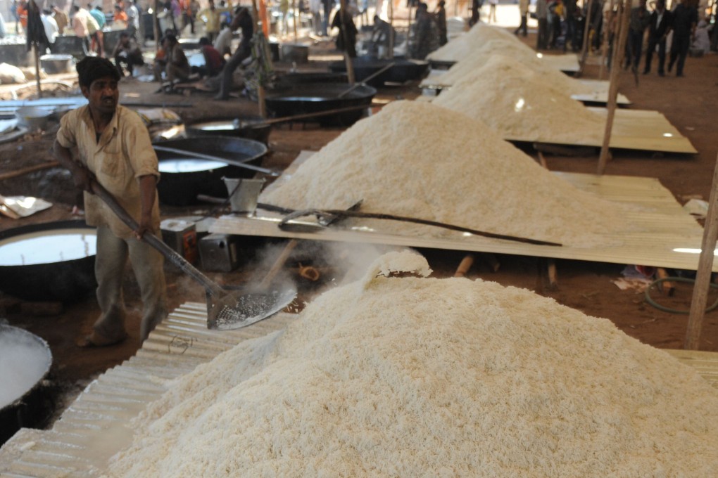 A man prepares basmati rice during the Brahma Chorayasi festival in Ahmedabad, India. File photo: TNS
