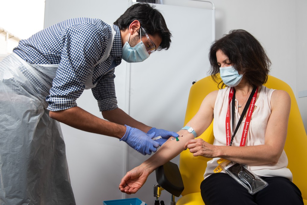 A health worker injects a volunteer with the coronavirus vaccine developed by AstraZeneca and Oxford University in this undated handout picture. Photo: DPA