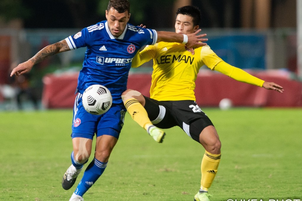 Eastern's Everton Camargo tries to escape the attentions of Lee Man's Wong Chun-ho in the Hong Kong Premier League meeting at Tseung Kwan O Sports Ground. Photo: HKFA