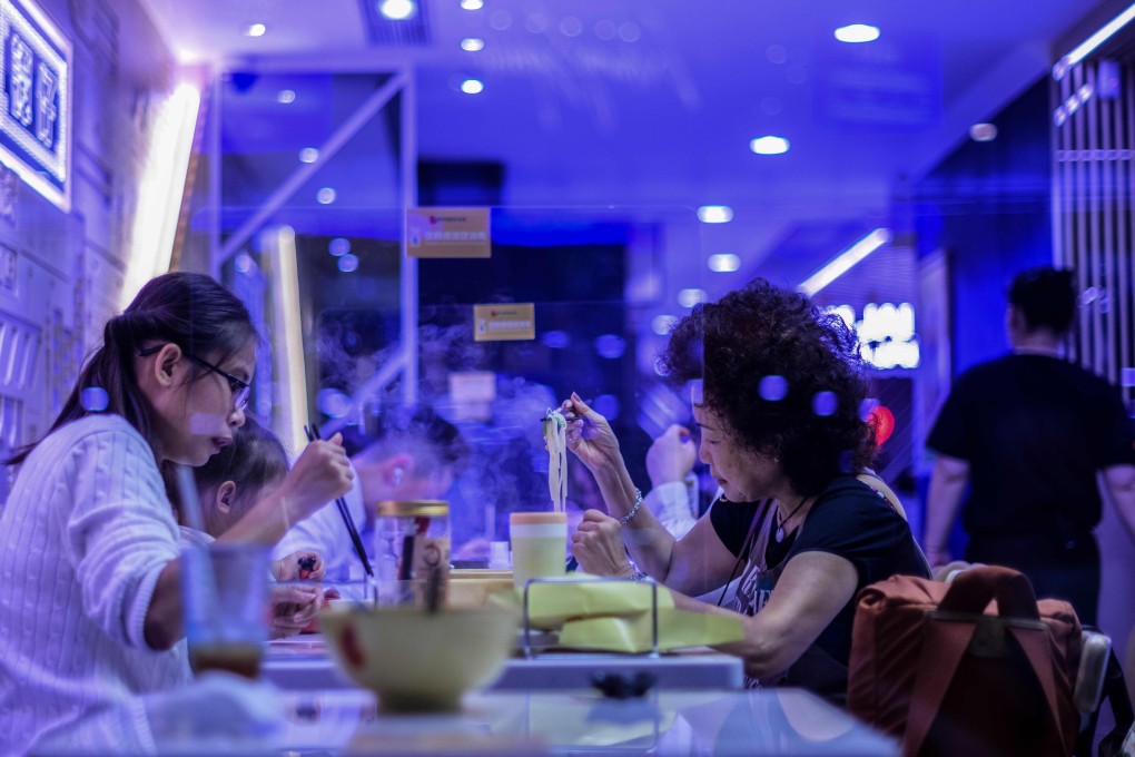 More than 10 staff and customers of three restaurants on Hong Kong Island have been confirmed infected. Photo: AFP