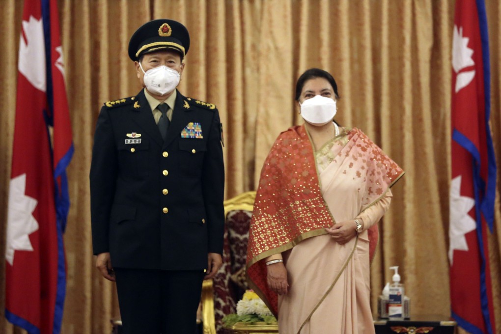 Nepalese President Bidya Devi Bhandari poses with visiting Chinese defence chief General Wei Fenghe in Kathmandu on Sunday. Photo: Xinhua