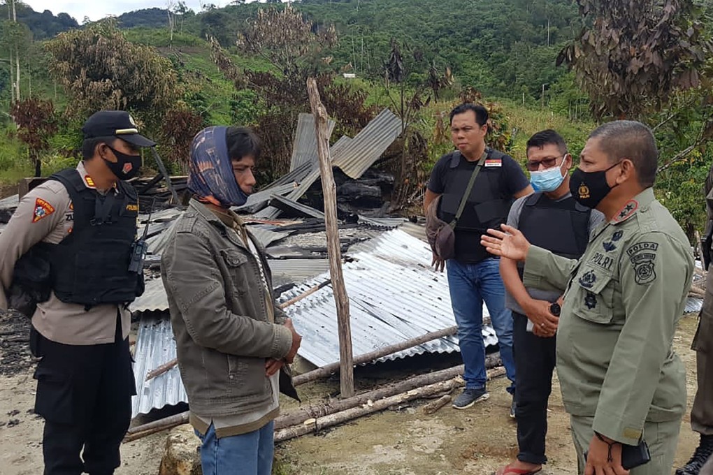 Police inspect a village in Central Sulawesi after a militant attack on Saturday. Photo: Handout/AFP