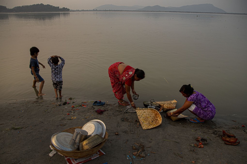 Indian women wash utensils in the Brahmaputra river in the northeastern Indian state of Assam. It is one of Asia's largest rivers, passing through China's Tibet region, India and Bangladesh before converging into the Bay of Bengal. Photo: AP