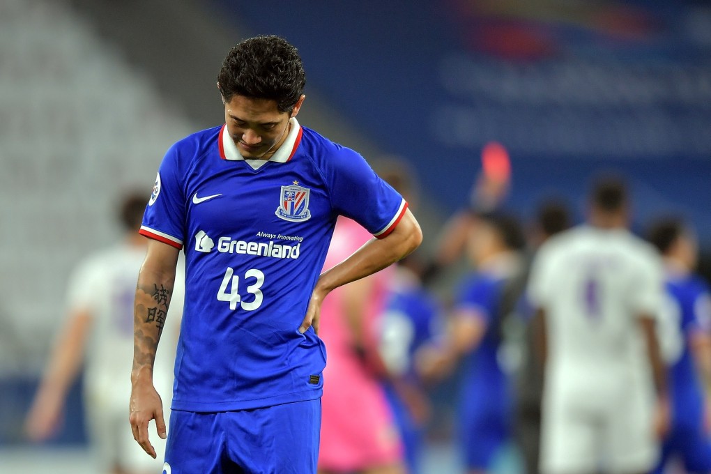 Shanghai Shenhua’s Alexander N‘Doumbou, also known as Qian Jiegei, reacts as teammate Cao Yunding is shown a red card at the end of their draw with Perth Glory in the AFC Champions League. Photo: EPA