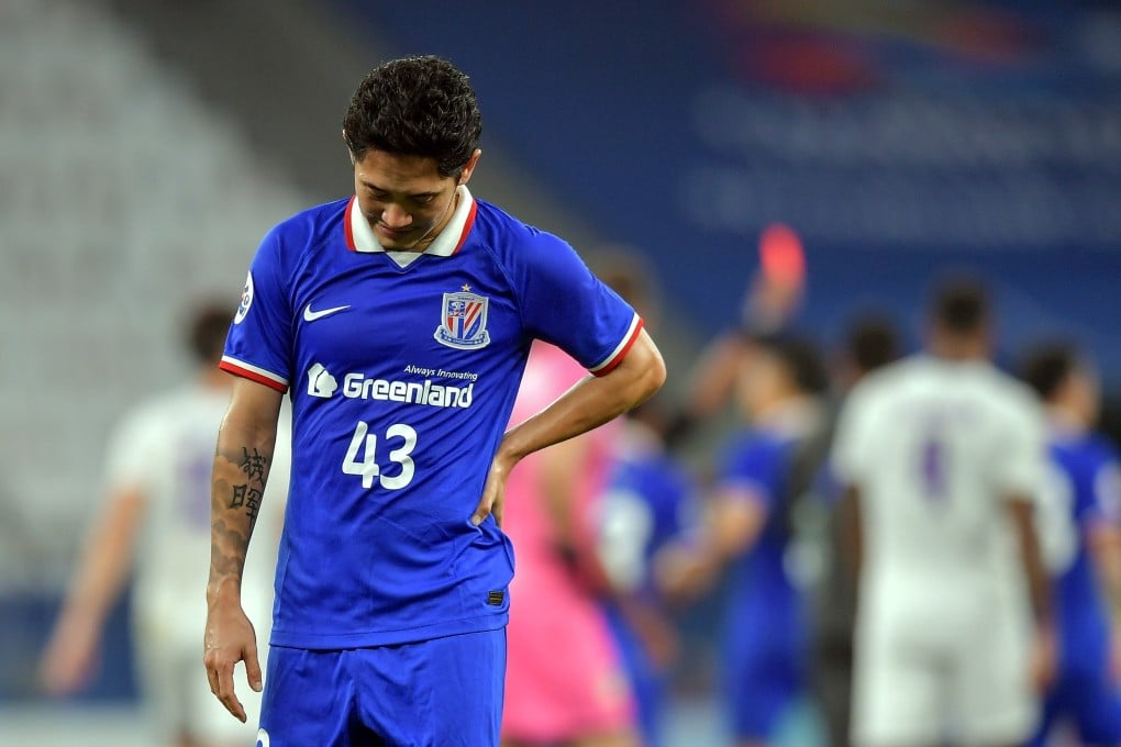 Shanghai Shenhua’s Alexander N‘Doumbou, also known as Qian Jiegei, reacts as teammate Cao Yunding is shown a red card at the end of their draw with Perth Glory in the AFC Champions League. Photo: EPA