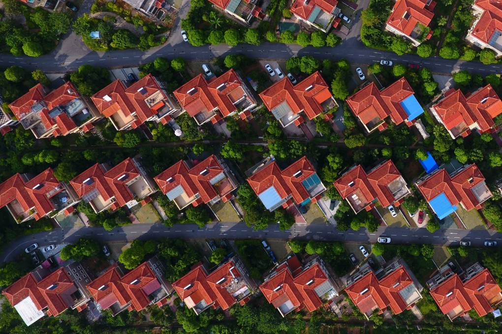 Property loans in China currently make up about 39 per cent of total outstanding bank lending, says Guo Shuqing. Photo: Xinhua