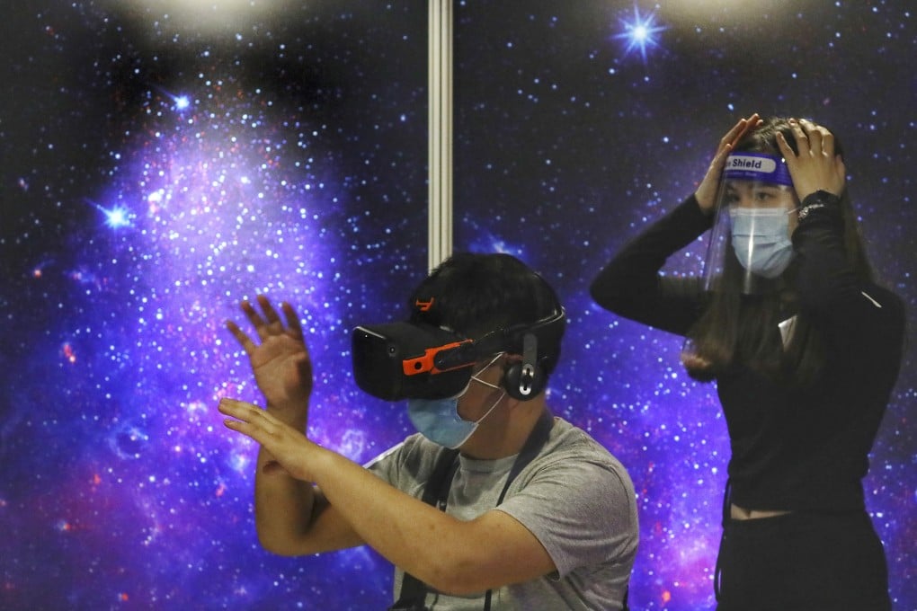 Visitors try out a virtual reality exhibition, “Univers/e”, at the Hong Kong Space Museum in Tsim Sha Tsui. Photo: Nora Tam