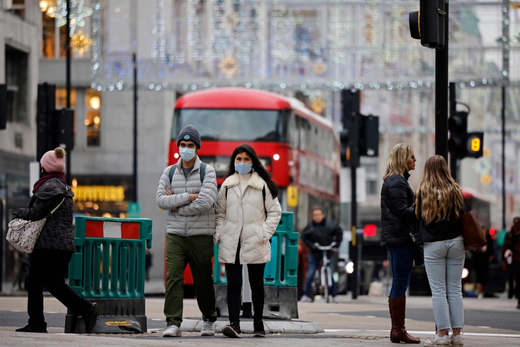 Pedestrians wearing face masks to combat the spread of the coronavirus, walk down Oxford Street in central London on November 27 as life under a second lockdown continues in England. Photo: AFP